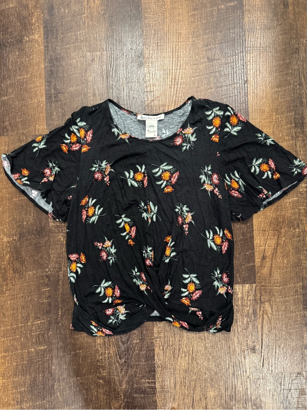 American Rag floral short sleeve twist front top
